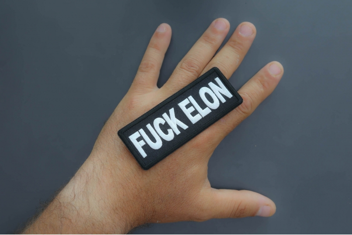 Fuck Elon Patch shown on hand for size comparison
