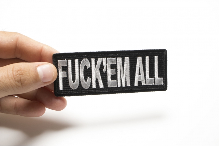 Fuck'em All Naughty Iron on Patch shown on hand for size comparison