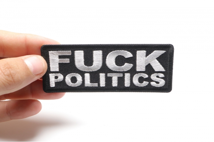 Fuck Politics Naughty Iron on Patch shown on hand for size comparison
