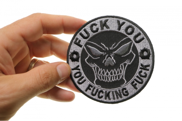 Fuck You You Fucking Fuck Skull Naughty Iron on Patch shown on hand for size comparison