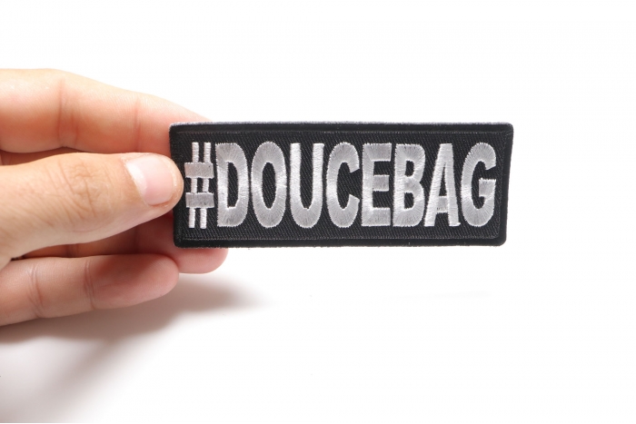 Hashtag Doucebag Funny Iron on Patch shown on hand for size comparison