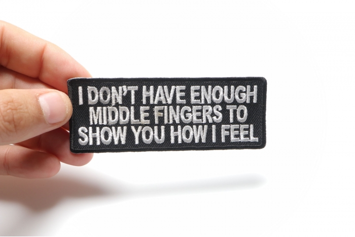 I Don't Have Enough Middle Fingers To Show You How I Feel Naughty Iron on Patch shown on hand for size comparison