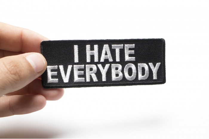 I Hate Everybody Naughty Iron on Patch shown on hand for size comparison