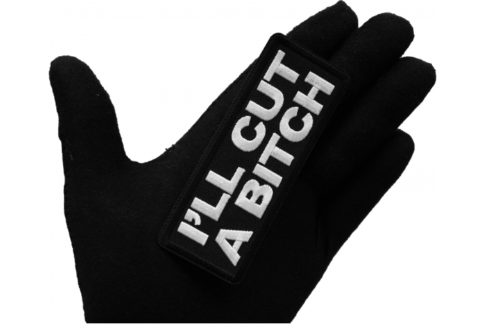 I'll Cut a Bitch Iron on Patch shown on hand for size comparison
