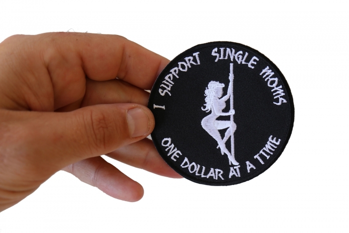 I Support Single Moms One Dollar at a Time Naughty Iron on Patch shown on hand for size comparison