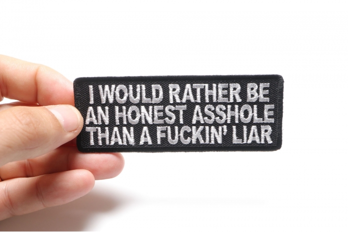 I Would Rather Be An Honest Asshole Than A Fucking Liar Naughty Iron on Patch shown on hand for size comparison