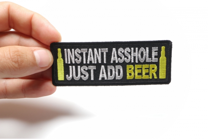 Instant Asshole Just Add Beer Funny Iron on Patch shown on hand for size comparison
