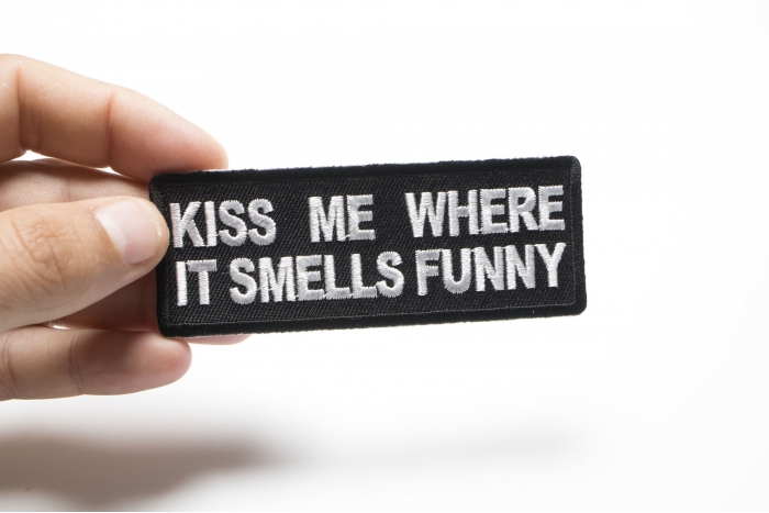 Kiss Me Where it Smells Funny Patch shown on hand for size comparison