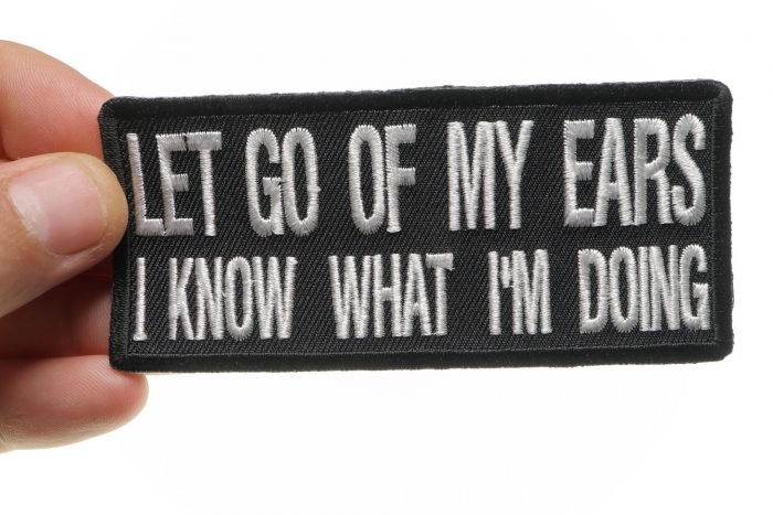 Let Go Of My Ears I Know What I'm Doing Funny Iron on Patch shown on hand for size comparison