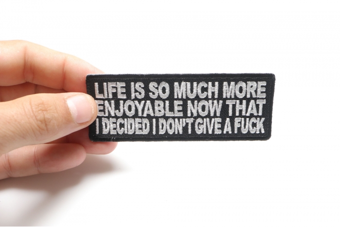 Life Is More Enjoyable Now That I Don't Give A Fuck Anymore Fun Patch shown on hand for size comparison