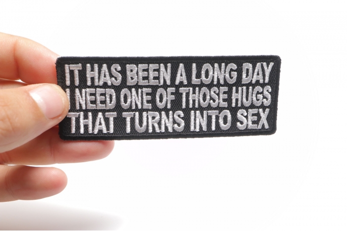 Long Day Need A Hug That Turns To Sex Patch shown on hand for size comparison