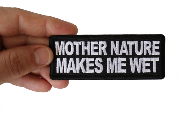 Mother Nature Makes me Wet Funny Iron on Patch shown on hand for size comparison