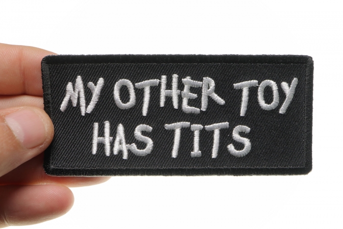 My Other Toy Has Tits Patch, Funny Patches for Adults shown on hand for size comparison