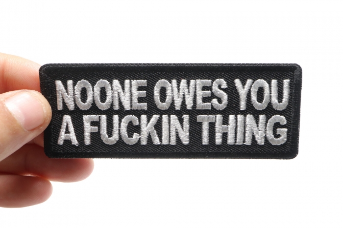 Noone Owes You a Fucking Thing Patch shown on hand for size comparison