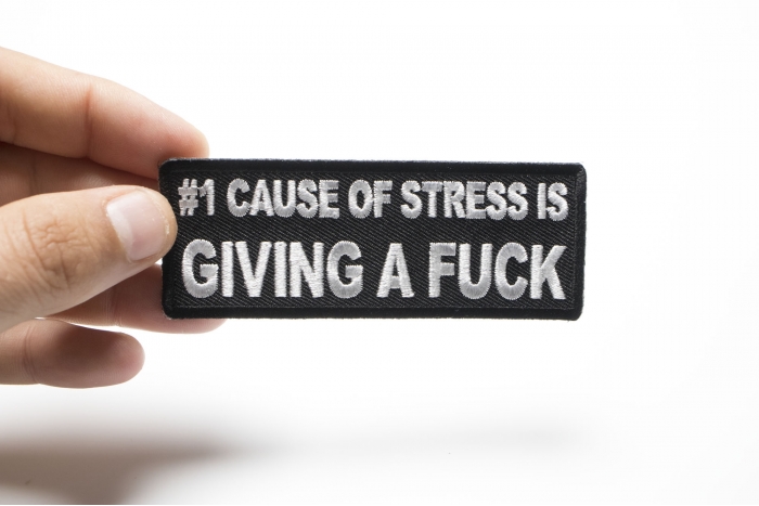 Number 1 Cause of Stress Is Giving a Fuck Patch shown on hand for size comparison