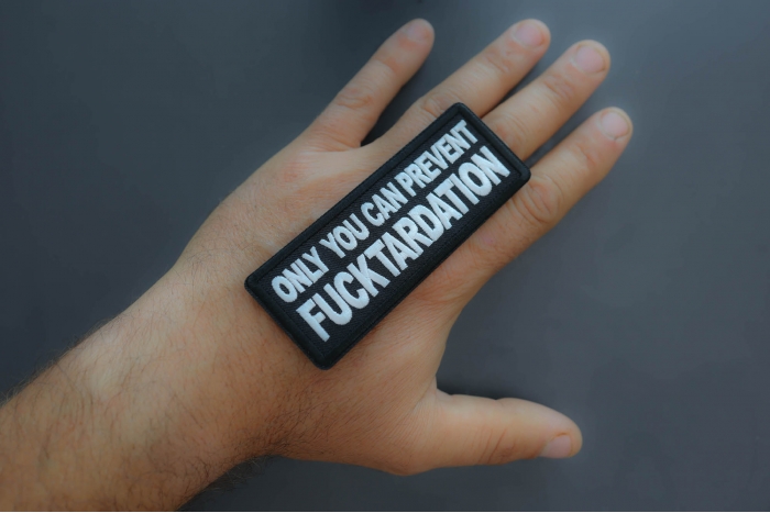 Only you can prevent Fucktardation Patch shown on hand for size comparison