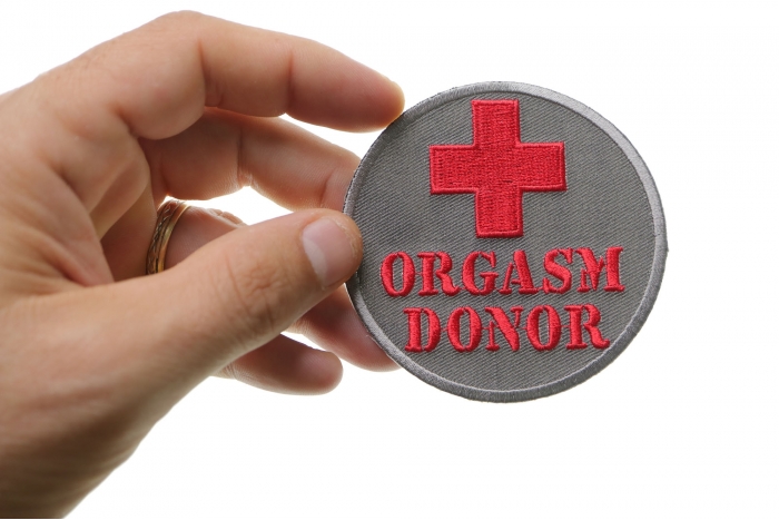 Orgasm Donor Patch shown on hand for size comparison