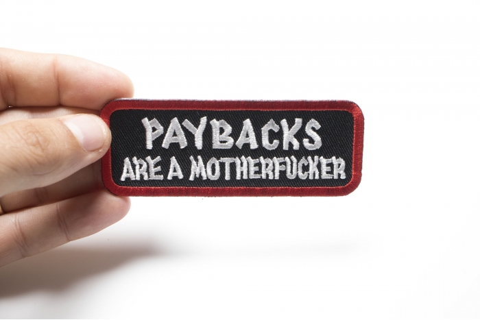 Paybacks Are A Motherfucker Patch, Saying Patches shown on hand for size comparison
