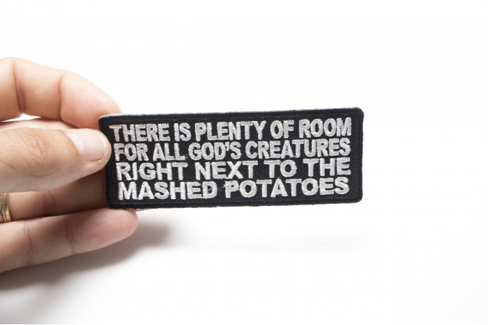 Plenty Of Room For All Gods Creatures Patch shown on hand for size comparison