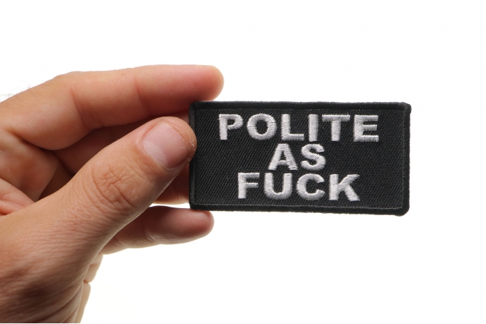 Polite As Fuck Funny Patch shown on hand for size comparison