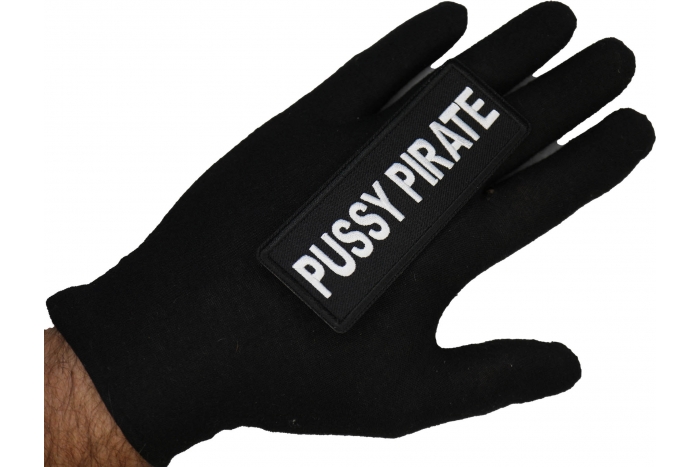 Pussy Pirate Patch shown on hand for size comparison