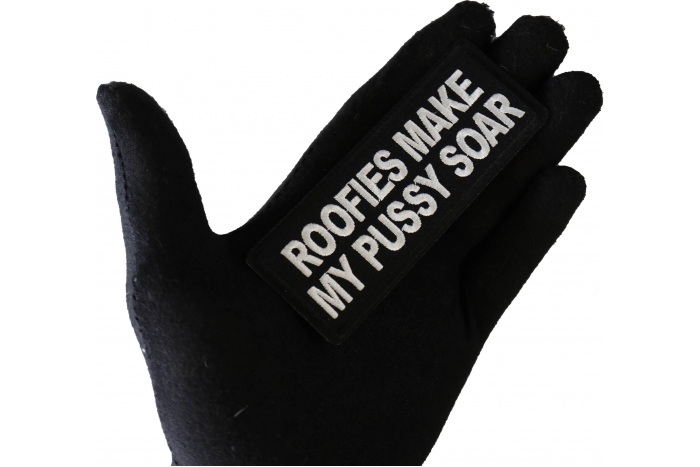Roofies Make My Pussy Soar Funny Iron on Patch shown on hand for size comparison