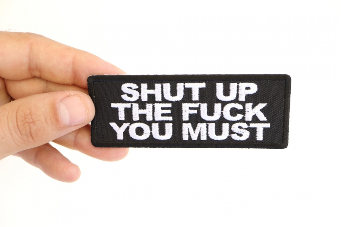 Shut up The Fuck You Must Funny Iron on Patch shown on hand for size comparison