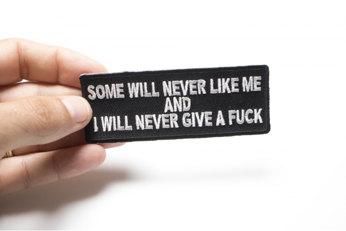 Some Will Never Like and I Will Never Give A Fuck Patch shown on hand for size comparison