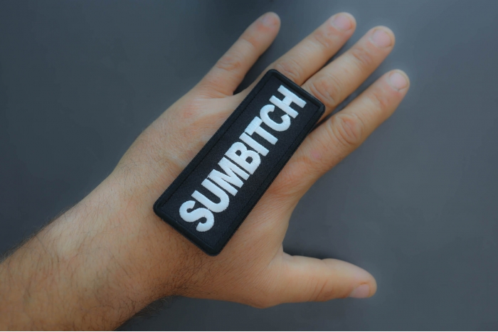 Sumbitch Patch shown on hand for size comparison