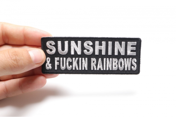 Sunshine and Fuckin Rainbows Patch, Funny Patches for Adults shown on hand for size comparison