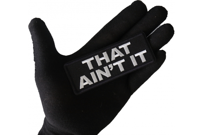 That Ain't It Patch shown on hand for size comparison