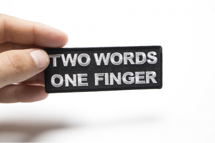 Two Words One Finger Patch shown on hand for size comparison