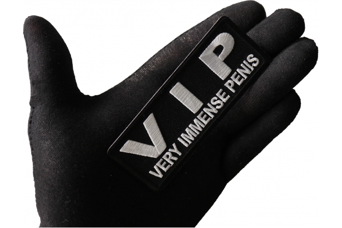 VIP Very Immense Penis Patch shown on hand for size comparison