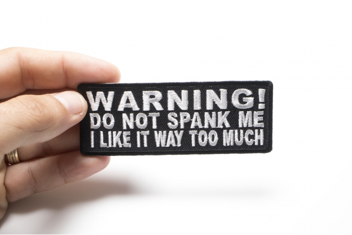 Warning Do Not Spank Me I Like It Way Too Much Patch shown on hand for size comparison