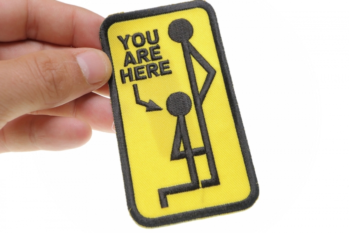 You Are Here Patch shown on hand for size comparison