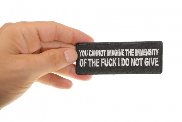 You Cannot Imagine The Immensity of The Fuck I Do Not Give Funny Iron on Patch shown on hand for size comparison