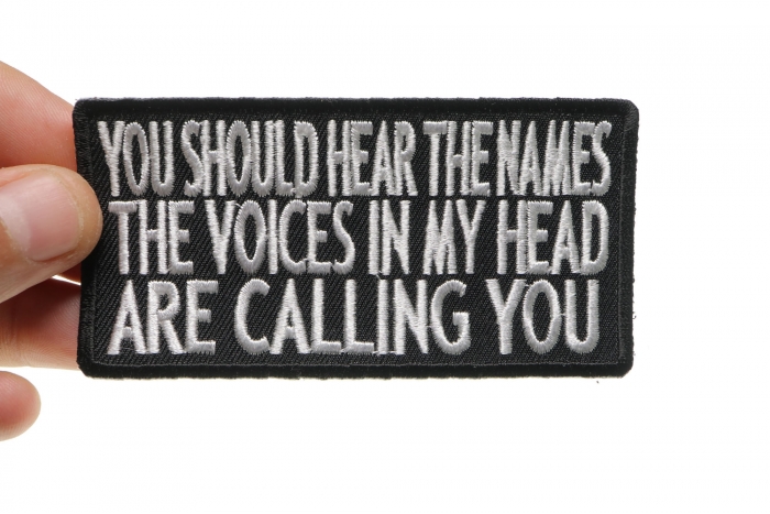 You Should Hear The Names The Voices In My Head Are Calling You Funny Iron on Patch shown on hand for size comparison