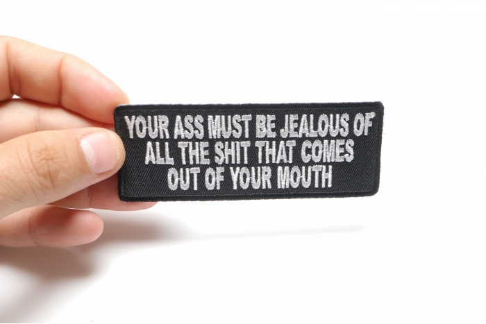 Your Ass Must Be Jealous Of All The Shit That Comes Out Of Your Mouth Patch shown on hand for size comparison