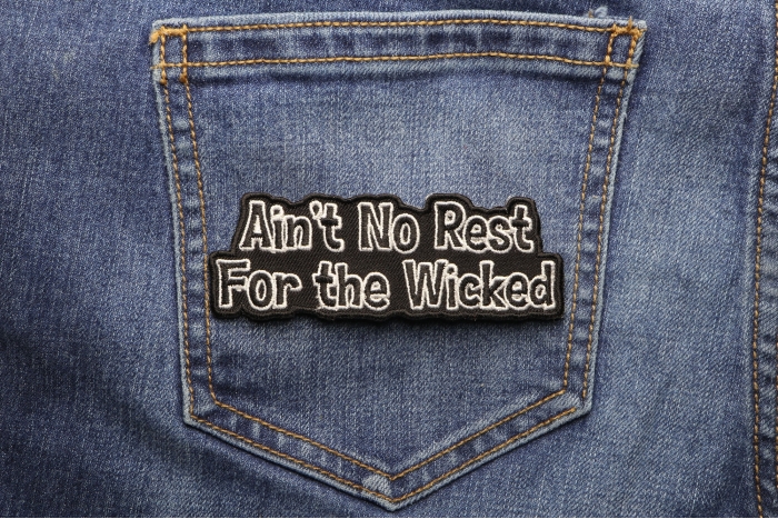 Ain't No Rest For The Wicked Patch shown on jeans