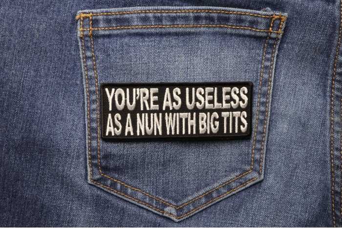 Your As Useless As A Nun With Big Tits Funny Naughty Patch shown on jeans