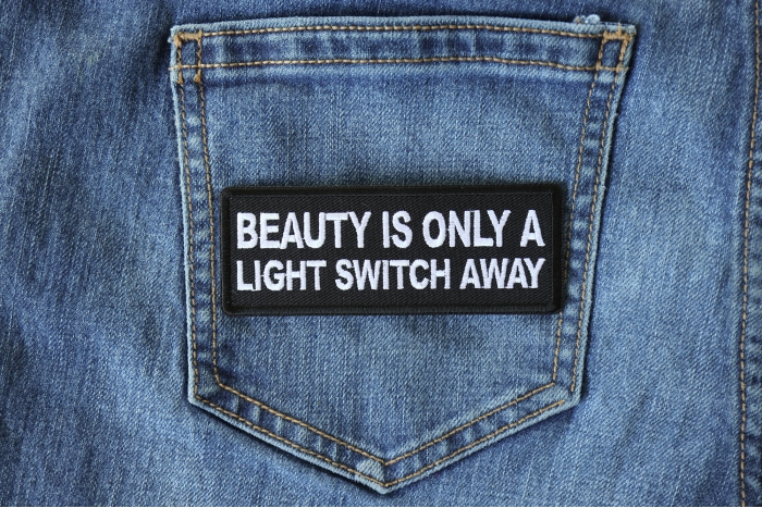 Beauty is Only a Light Switch Away Patch shown on jeans