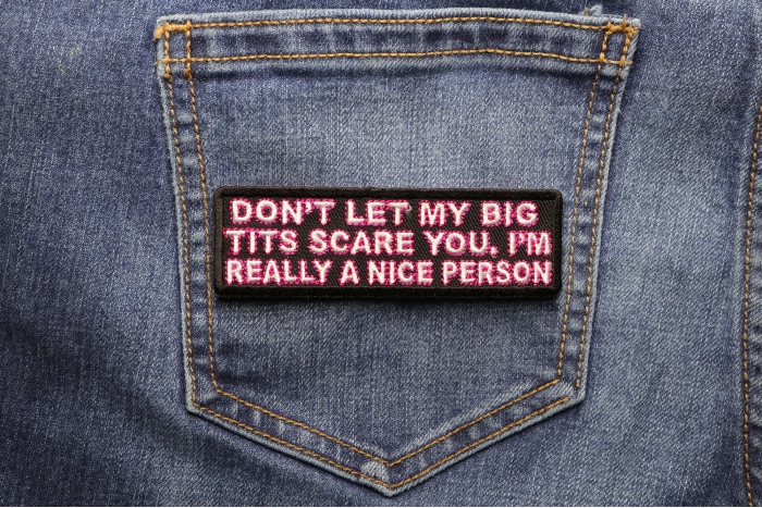 Don't Let My Big Tits Scare You I'm Really A Nice Person Patch shown on jeans