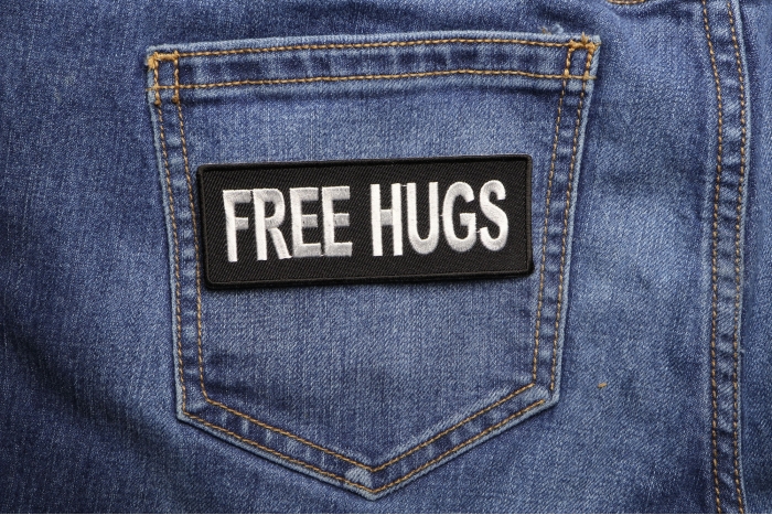 Free Hugs Naughty Iron on Patch shown on jeans