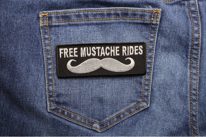 Free Mustache Rides Patch shown on jeans