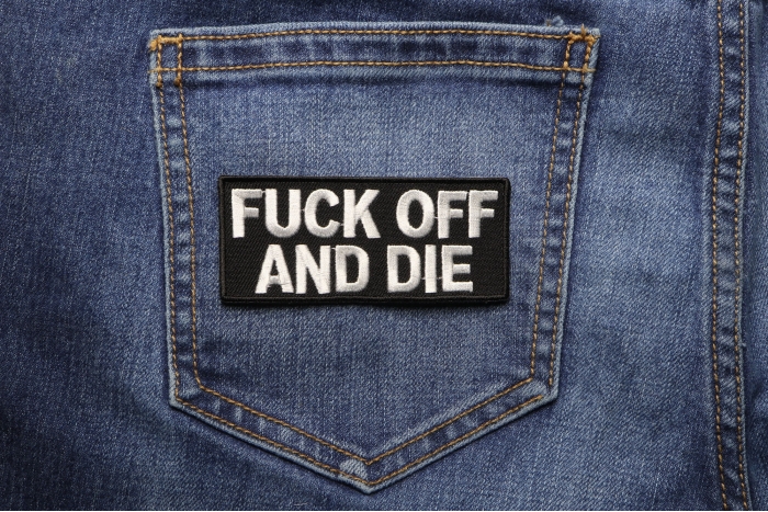 Fuck Off and Die Patch shown on jeans