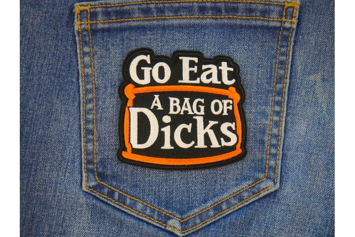 Go Eat a Bag of Dicks Patch shown on jeans