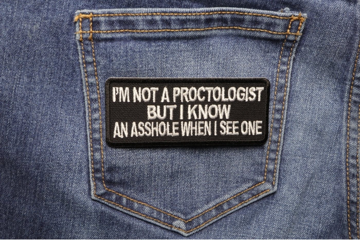 I'm Not A Proctologist But I Know An Asshole When I See One Patch shown on jeans