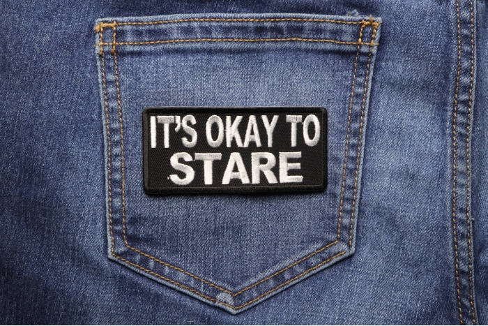 It's Okay To Stare Funny Iron on Patch shown on jeans