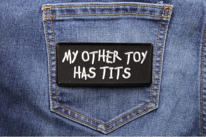 My Other Toy Has Tits Patch shown on jeans