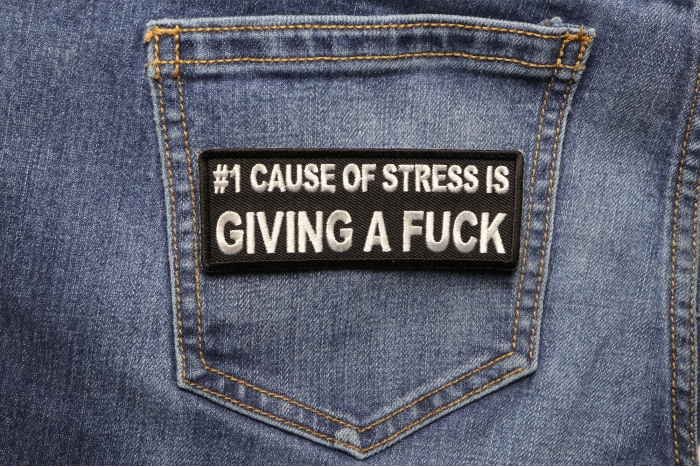 Number 1 Cause of Stress Is Giving a Fuck Patch shown on jeans